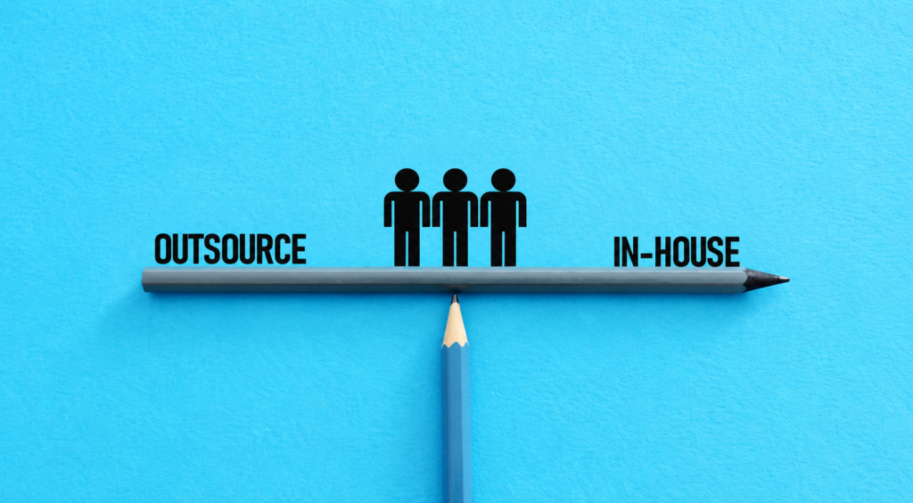 Blue background with a pencil balancing a line labeled OUTSOURCE on the left and IN-HOUSE on the right, and three black silhouettes above the line.